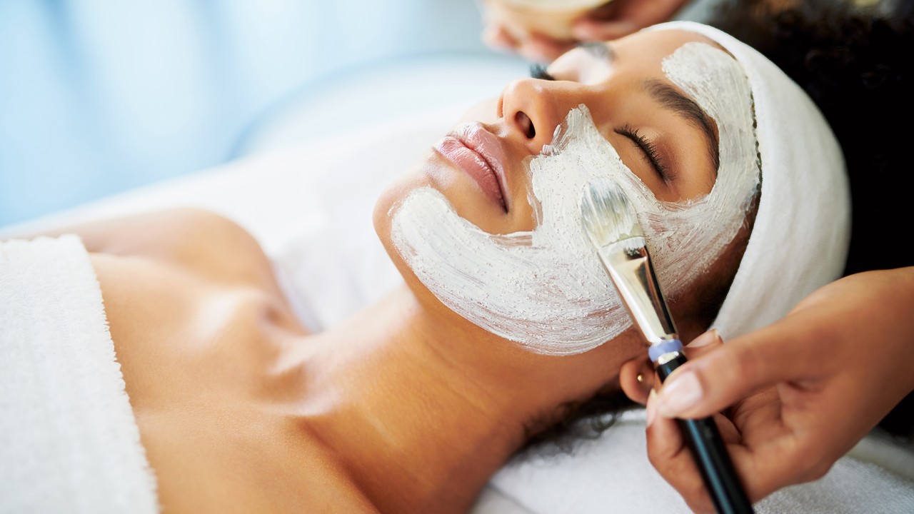 Shot of an attractive young woman getting a facial at a beauty spa