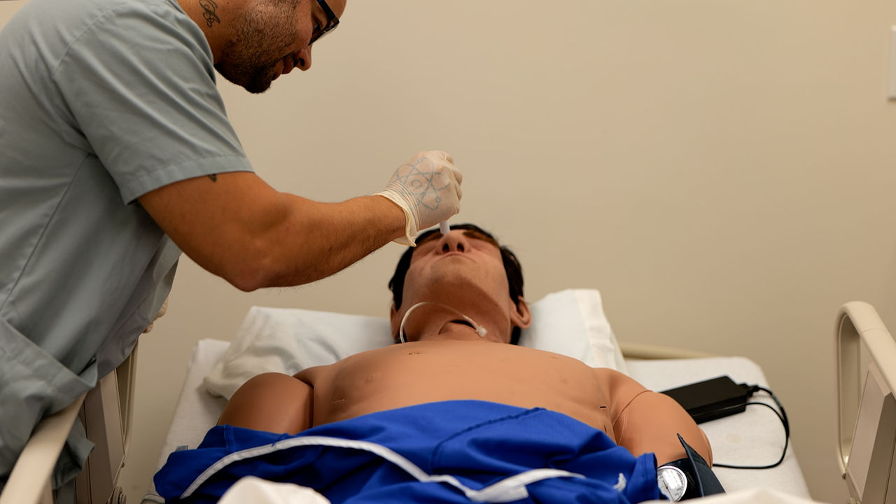 Medical professional performs procedure on patient in hospital