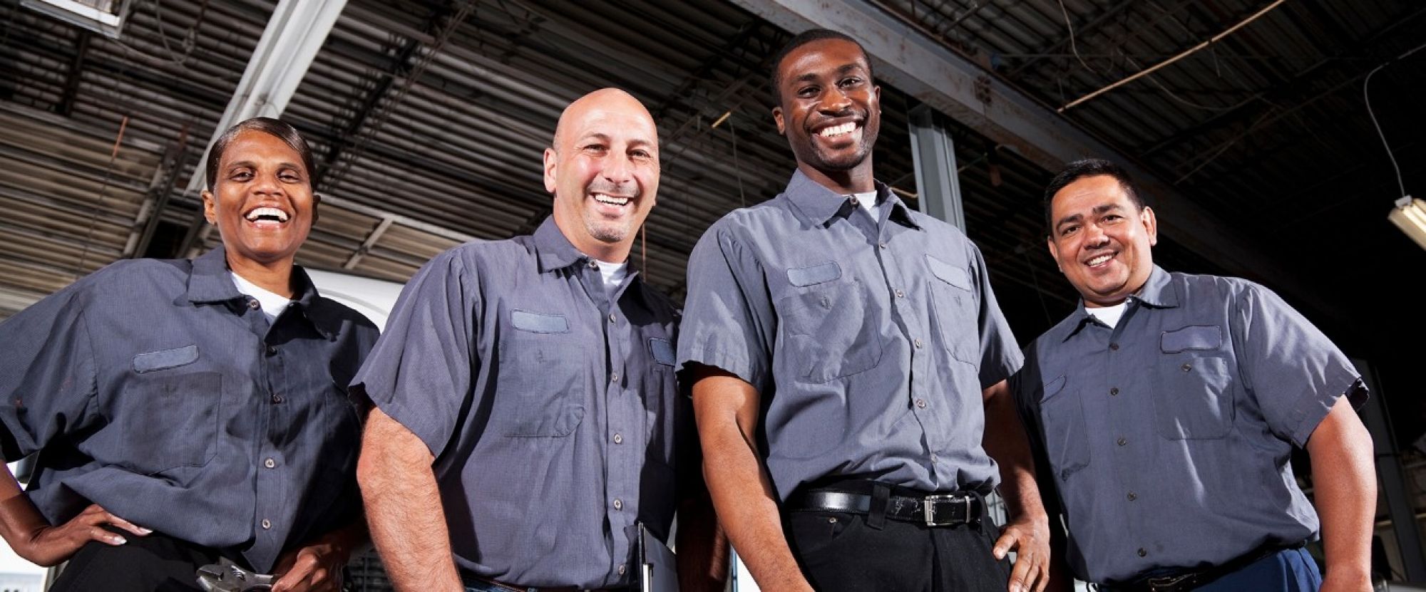 Multi-ethnic workers at trucking facility