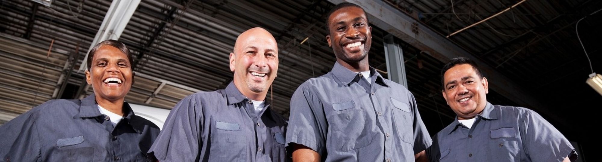 Multi-ethnic workers at trucking facility